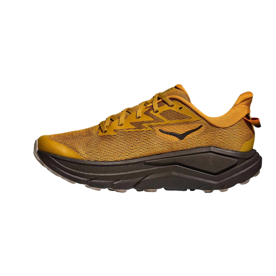 Mustard-yellow trail running shoe with black lugged sole and lace-up upper