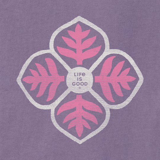Purple hooded tee with a pink and white leaf-flower graphic and the text "LIFE IS GOOD" on the chest