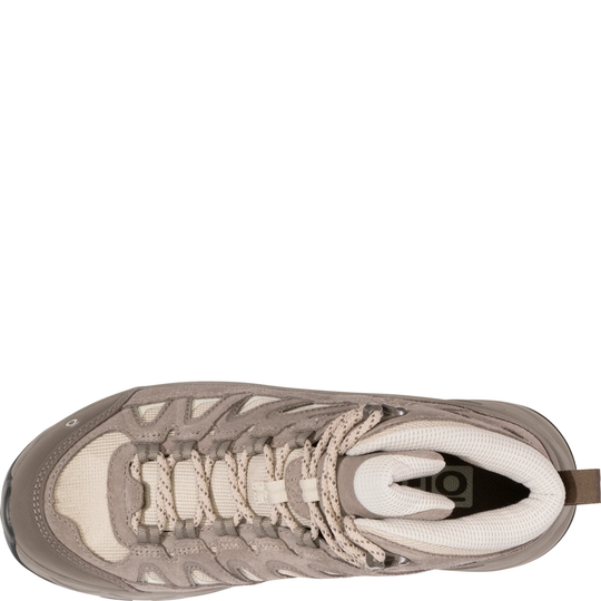 Top view of a beige and brown mid hiking boot with rugged laces and a padded collar