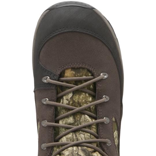 Top view of a brown and camouflage hunting boot with brown laces and metal eyelets