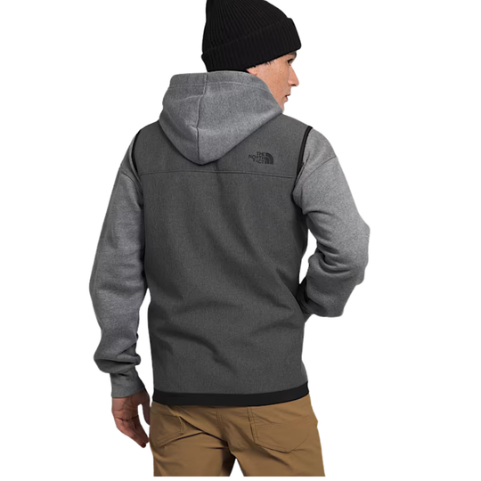 Person wearing a gray hoodie with The North Face logo on a white background