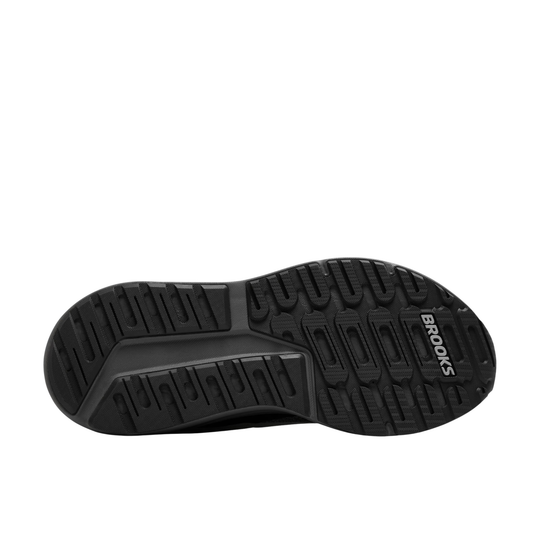 Black running shoe outsole with deep tread and Brooks branding