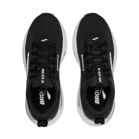 Black running shoes with white soles on a white background