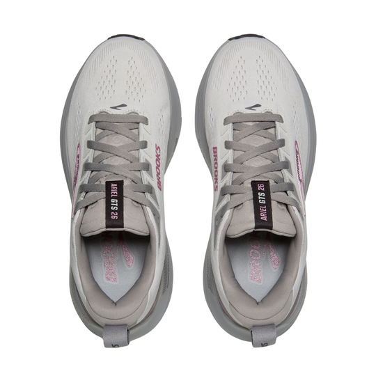 Pair of gray running shoes with visible branding on a white background