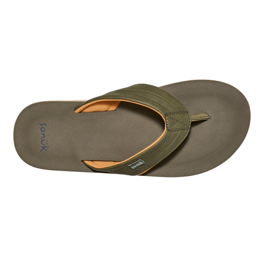 Green sandal with tan insole on a white background