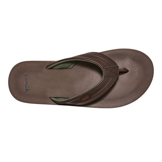 Brown sandal with green interior on a white background