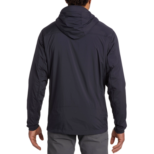 Person wearing a dark blue jacket with a hood on a white background