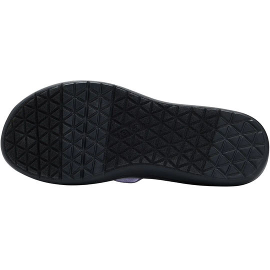 Black shoe sole with textured pattern on a white background