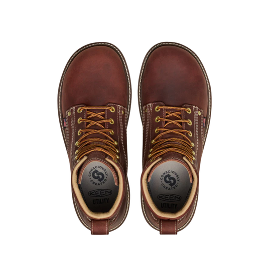 Pair of brown leather boots with visible brand logo on a white background