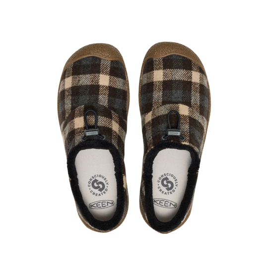 Pair of plaid slippers with KEEN logo on a white background