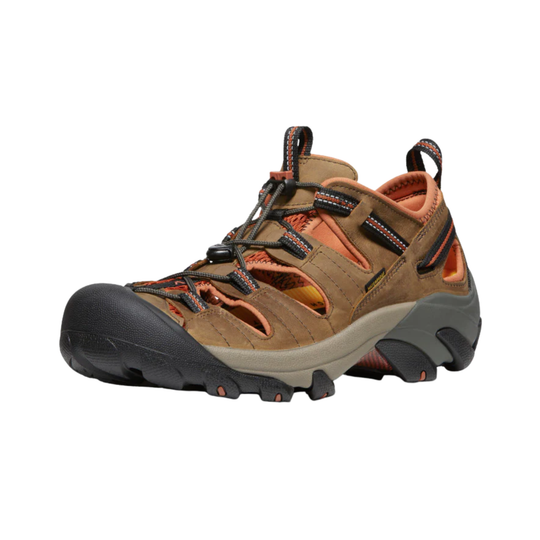 Brown hiking sandal with black sole on a white background