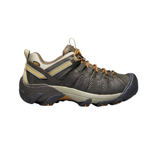 Gray hiking shoe with orange accents on a white background