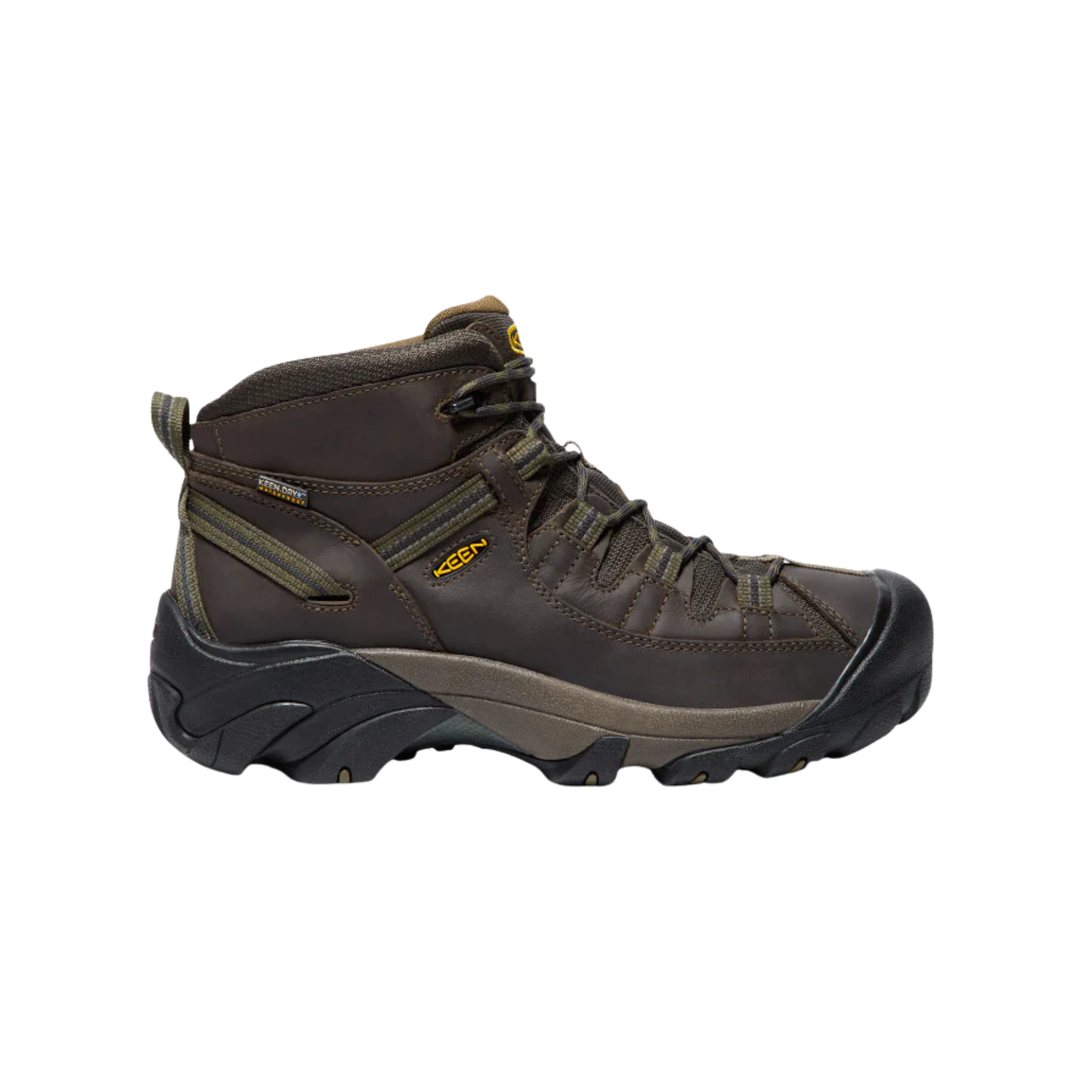 Brown leather hiking boot on a white background