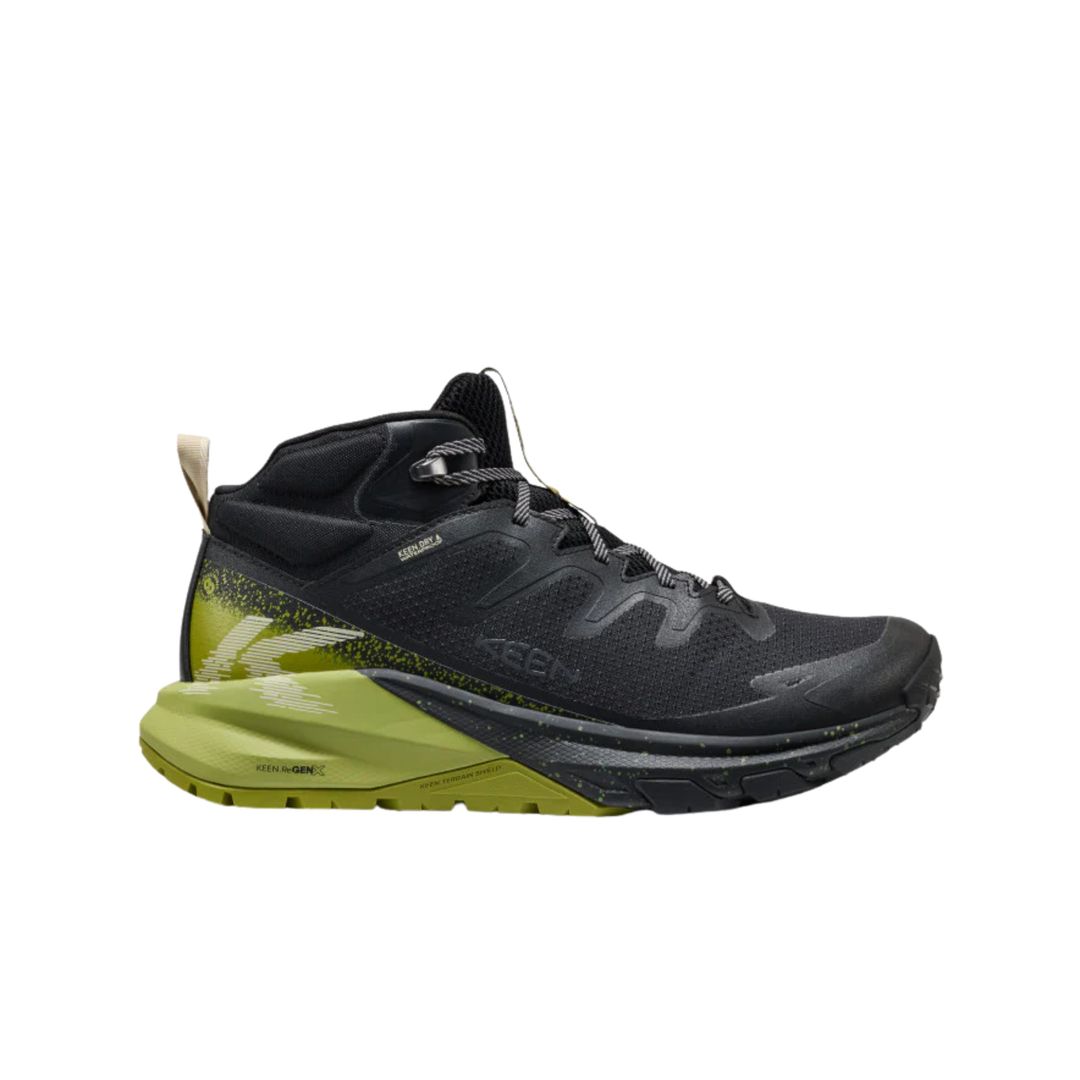 Black and green running boot on a white background