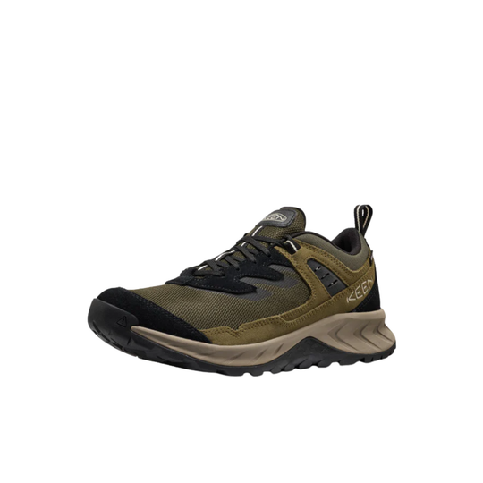 Green and black hiking shoe on a white background