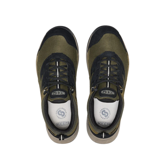 Pair of green and black sneakers with white soles on a white background