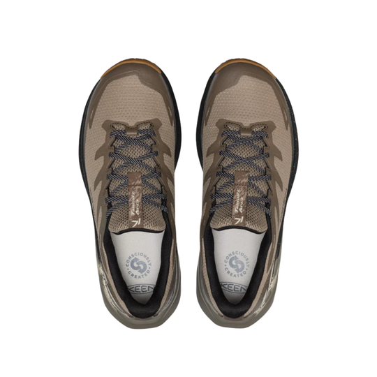 Pair of brown and tan hiking shoes with black laces on a white background