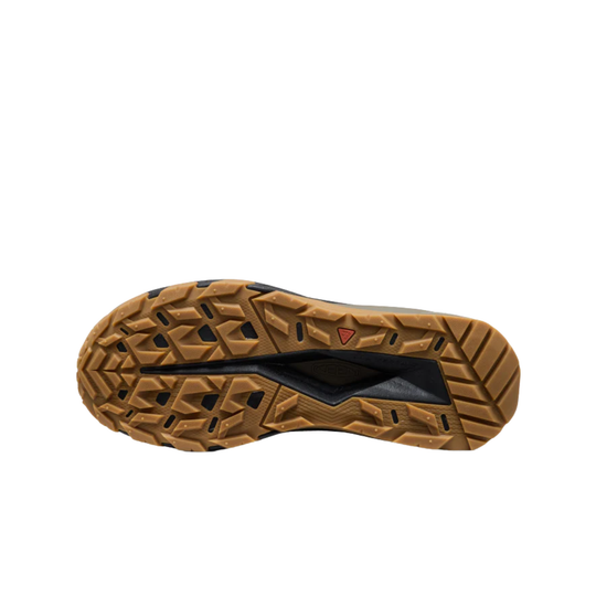 Close-up of a brown shoe sole with tread pattern on a white background