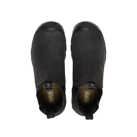 Pair of black ankle boots on a white background