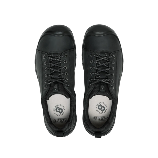 Black sneakers with a brand logo on a white background