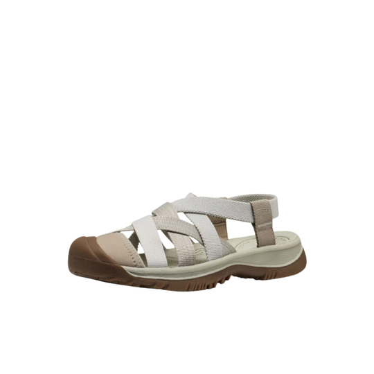 Beige sandal with a brown sole on a white background