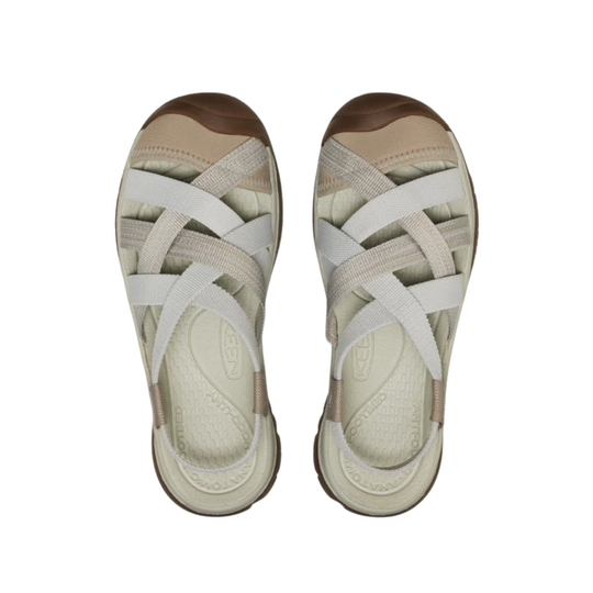Pair of sandals with beige and white straps on a white background