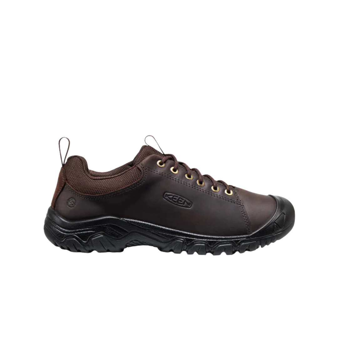 Brown shoe with black sole on a white background