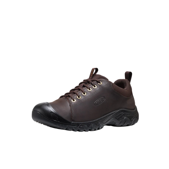 Brown leather shoe with black sole on a white background
