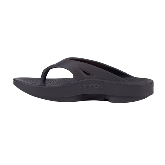 Black sandal with 'oofos' branding on a white background
