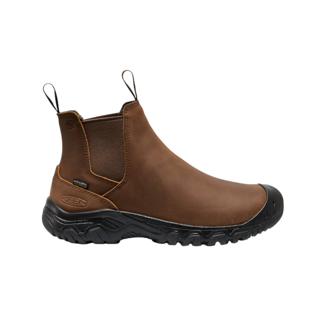 Brown boot with black sole on a white background
