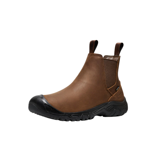 Brown leather boot with black sole on a white background