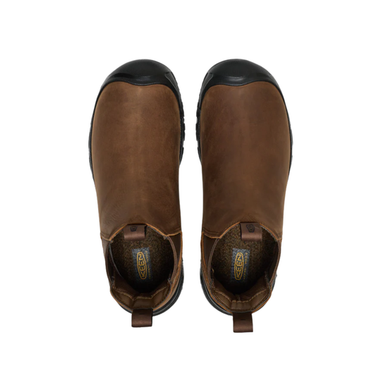 Pair of brown leather boots with black soles on a white background