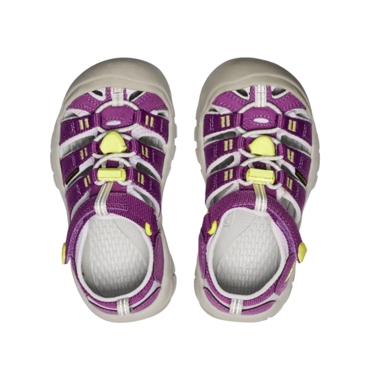 Purple and white sandals with green accents on a white background