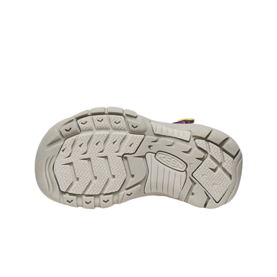 Close-up of a shoe sole with a brand logo on a white background