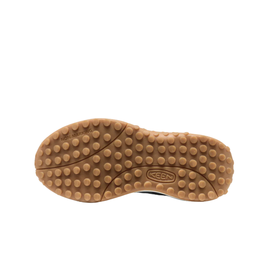 Brown sole of a shoe with Keen logo on a white background