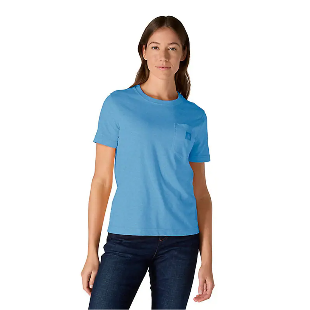 Woman wearing a light blue t-shirt and dark jeans on a white background