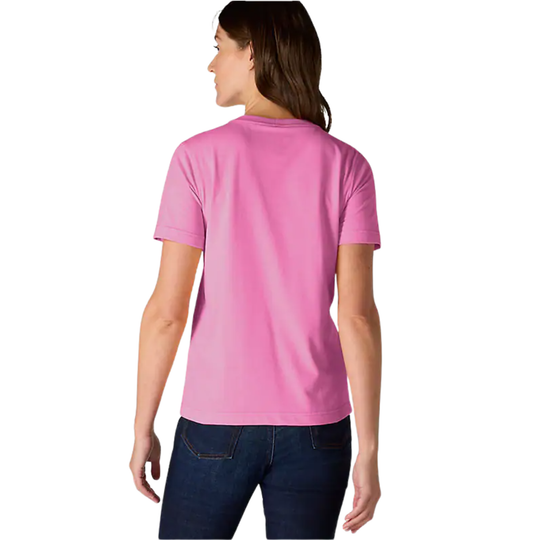 Person wearing a pink t-shirt and dark jeans on a light gray background