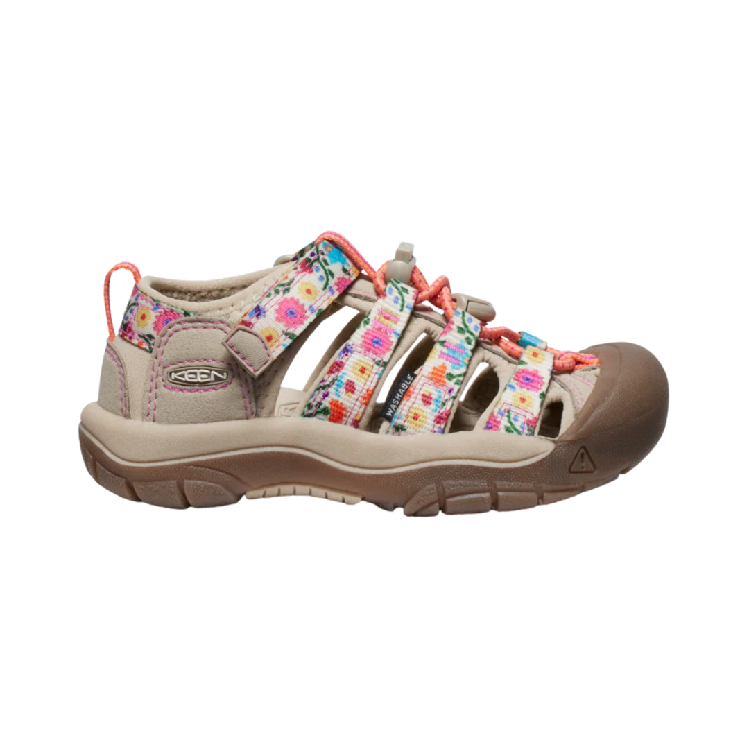 Beige sandal with floral straps on a white background