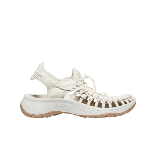 White sandal with brown sole on a white background