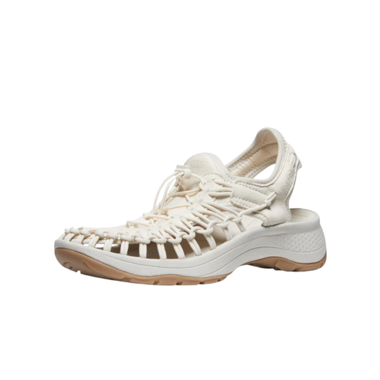 White sandal with brown sole on a white background