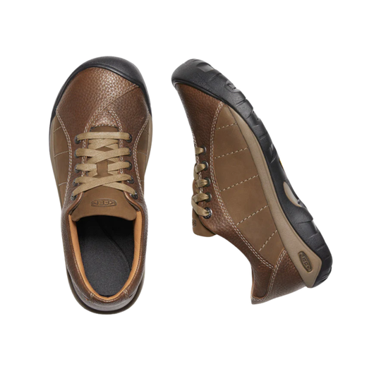 Pair of brown leather shoes on a white background