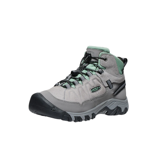 Gray hiking boot with black sole on a white background