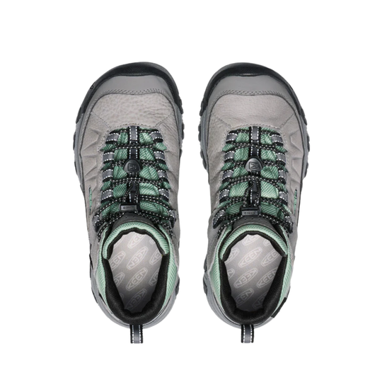 Pair of gray and green hiking boots on a white background