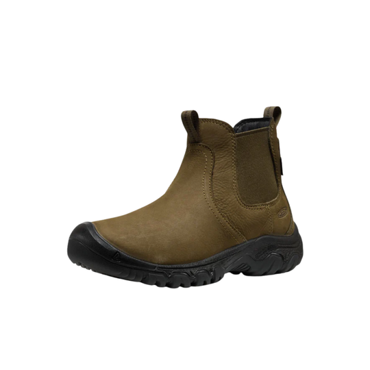 Brown ankle boot with black sole on a white background