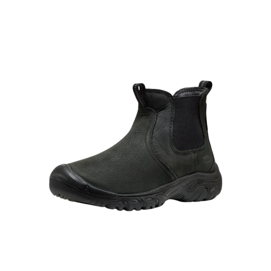 Black high-top sneaker on a gray background with 'CKXMHM' branding.