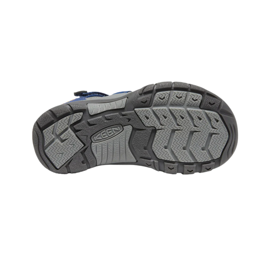 Close-up of a sandal sole with Keen branding on a white background