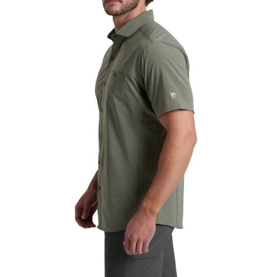 Man wearing a green short-sleeve shirt on a white background