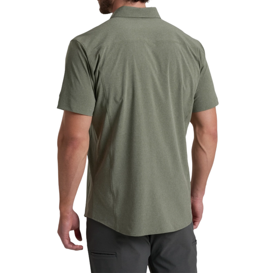 Person wearing a green short-sleeve shirt on a white background