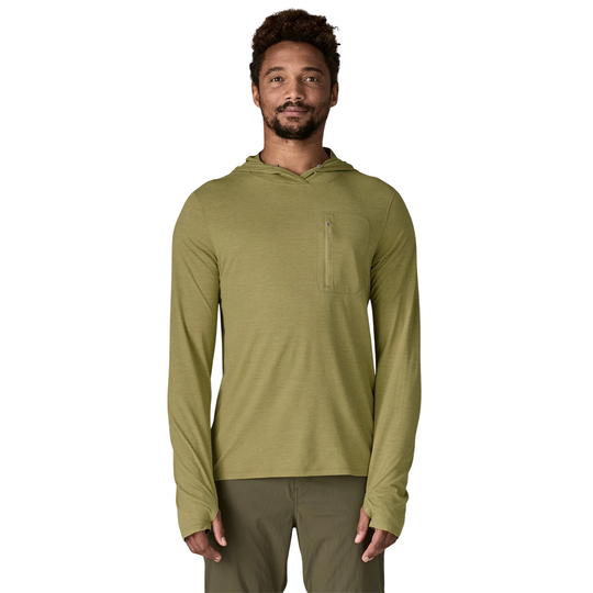 Man wearing a green hoodie on a white background