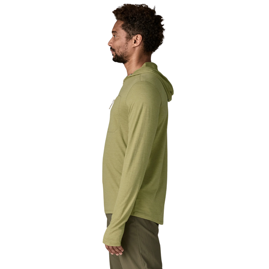 Man wearing a green hoodie on a white background